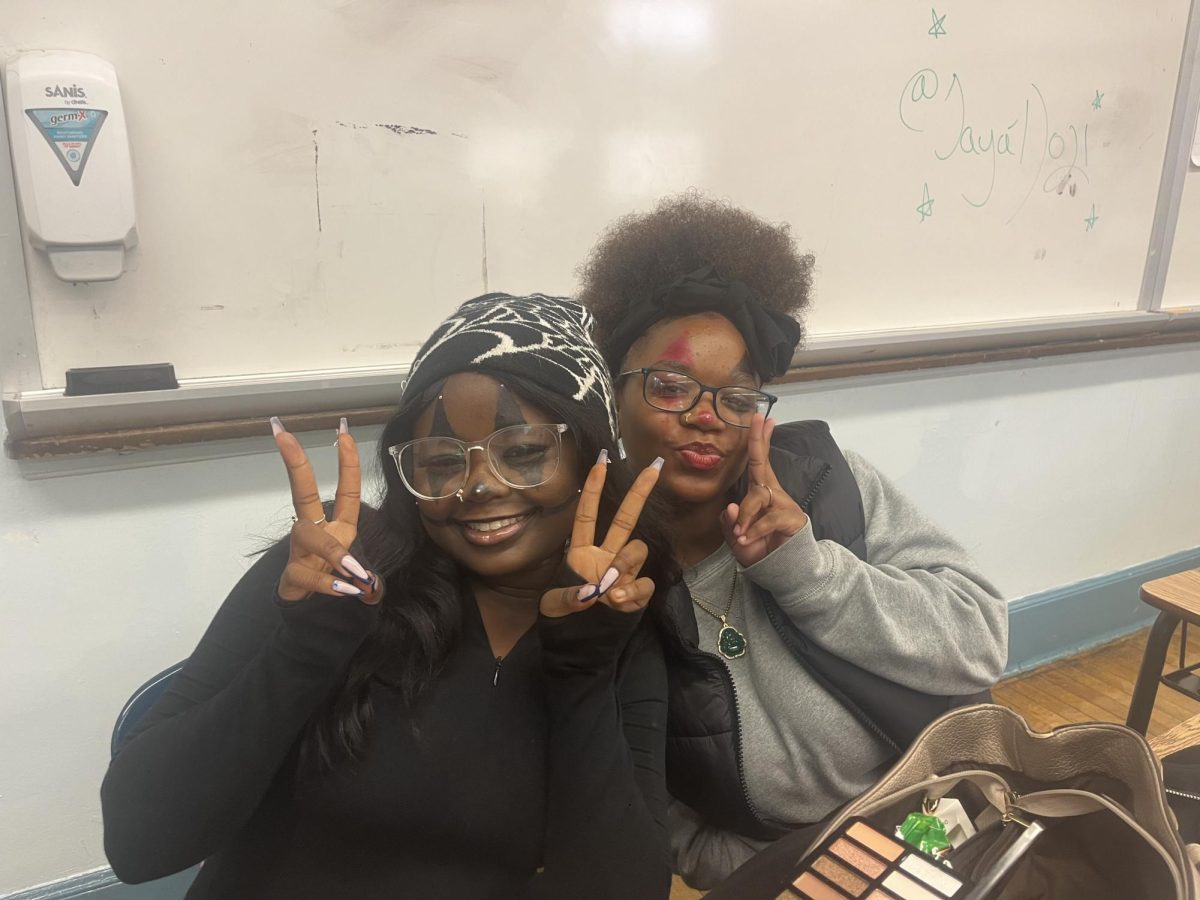 Sophomores Nadia Tchagodamou and Felisha Gale dressed as clowns 